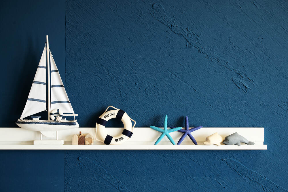 shelve with sea related items on