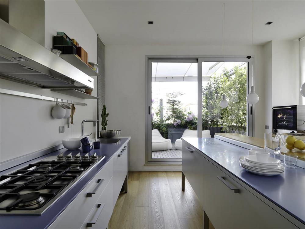 interiors of a modern kitchen that has an island kitchen