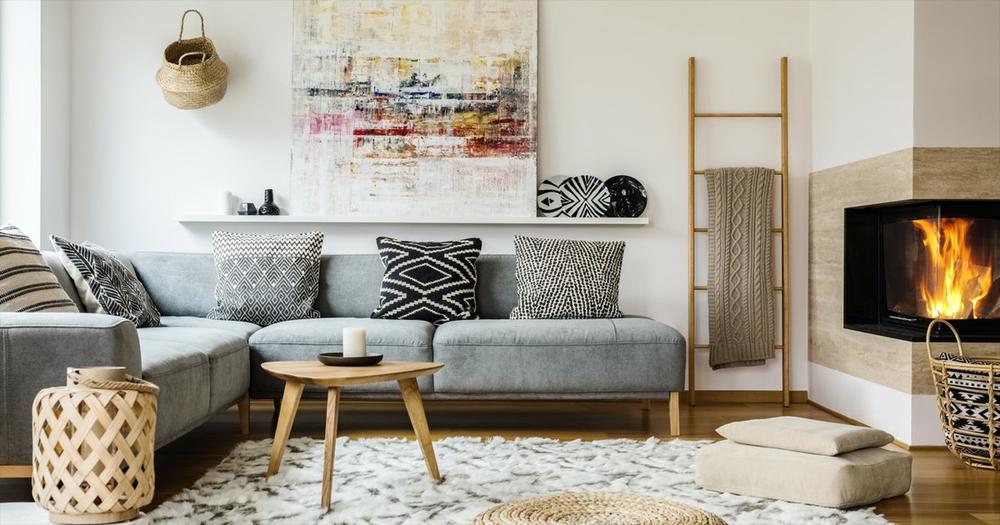 modern grey sofa and fireplace in modern boho living room