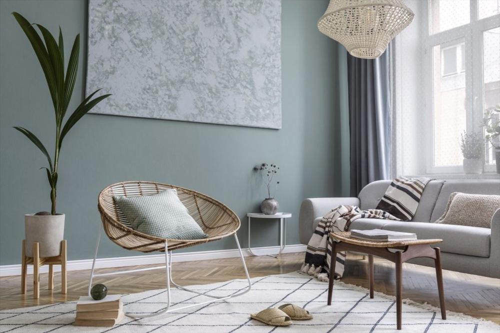 pastel toned living room with rattan chair