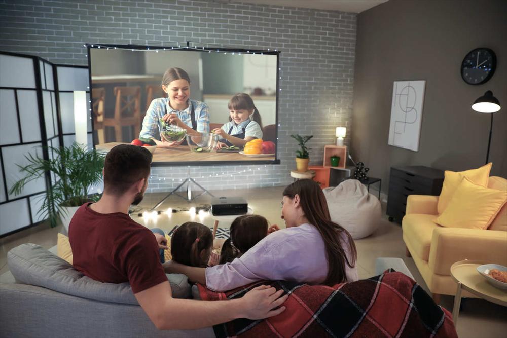 family watching a movie in cinema room