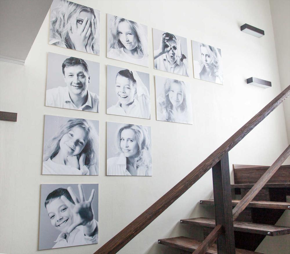 artworks hanged on the wall of a staircase