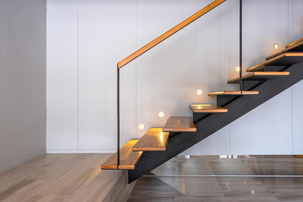 staircase with spot lights on the side